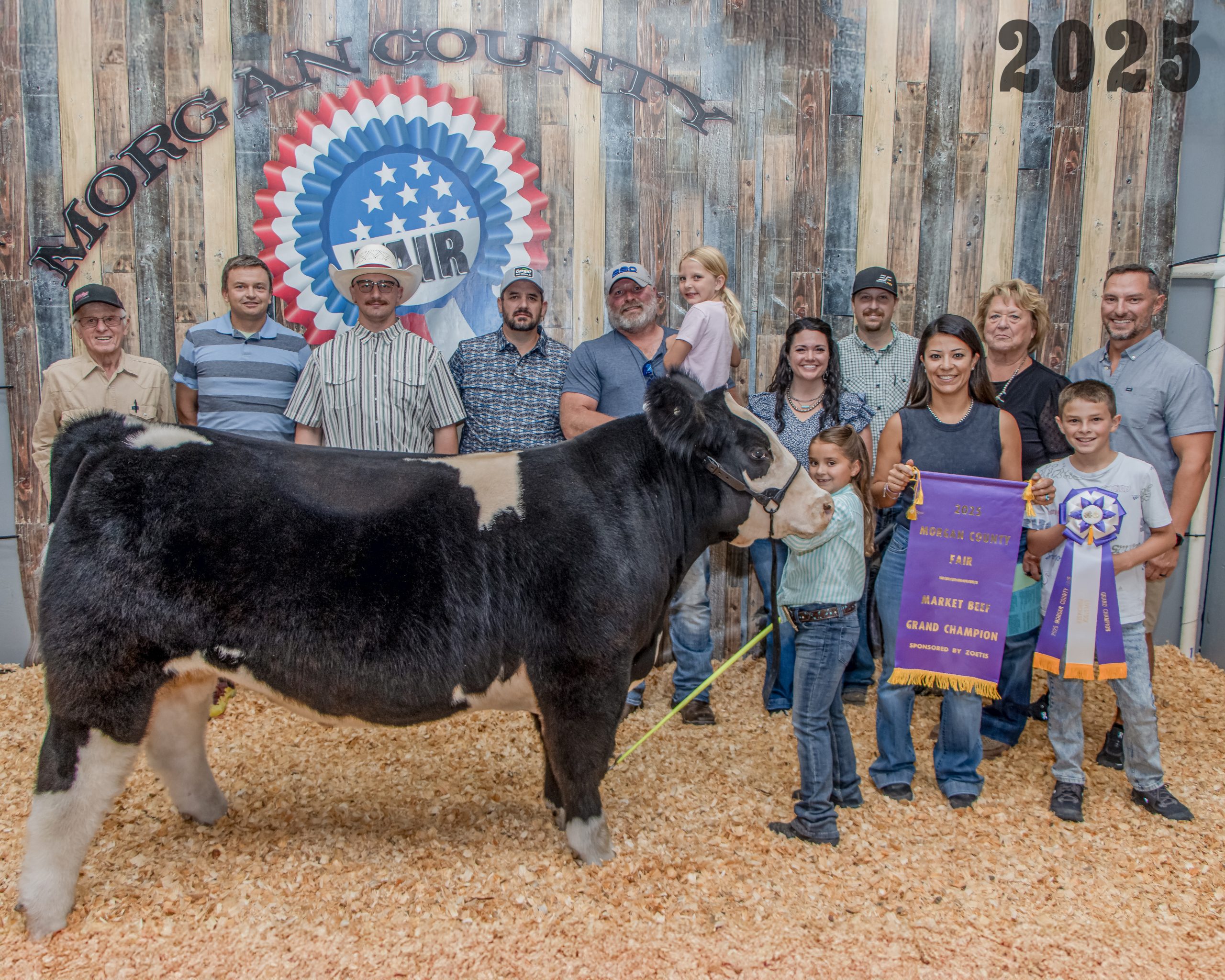 Grand Champion Market Beef - Jocelyn Drew with buyers