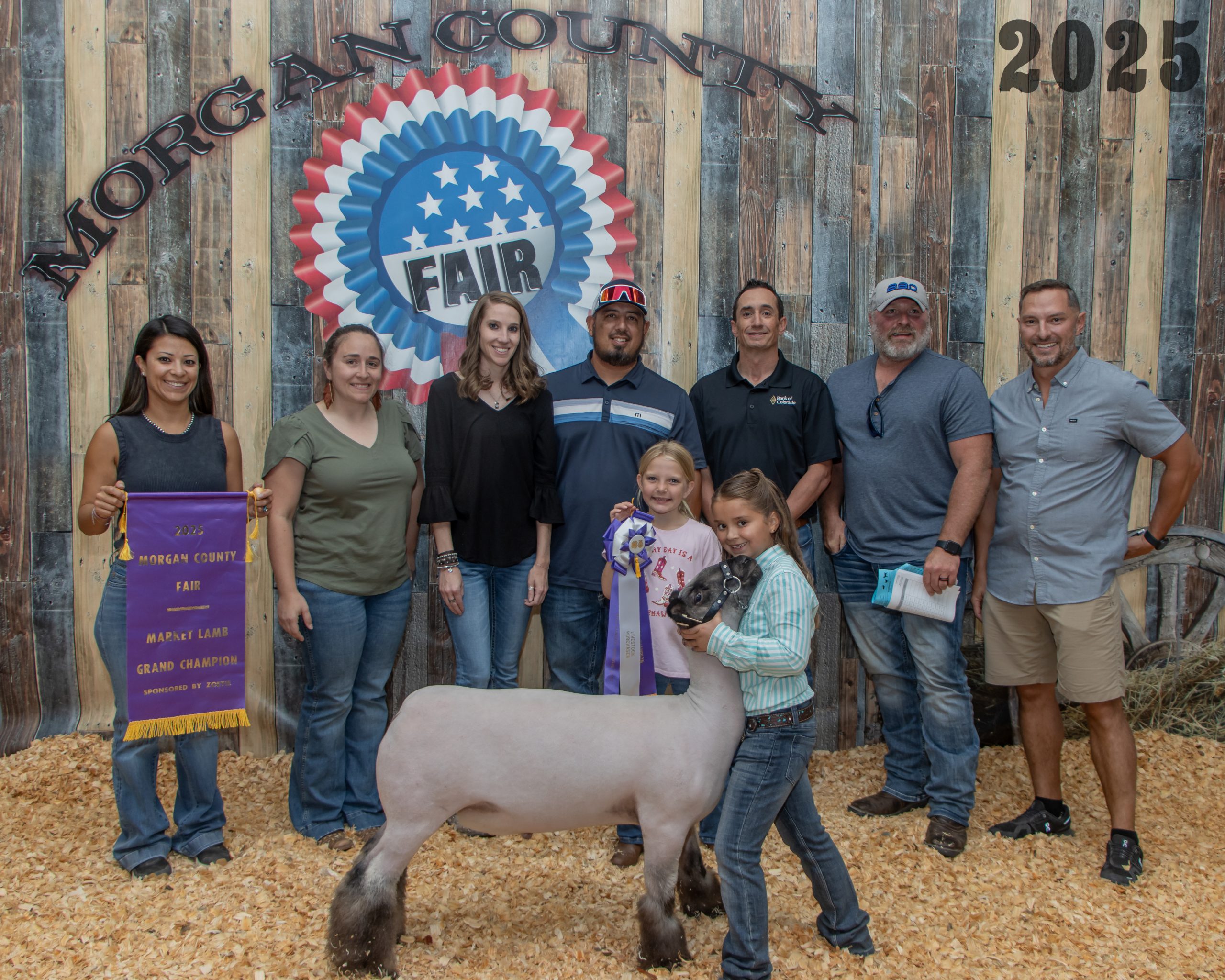 Grand Champion Market Lamb - Jocelyn Drew with Buyers