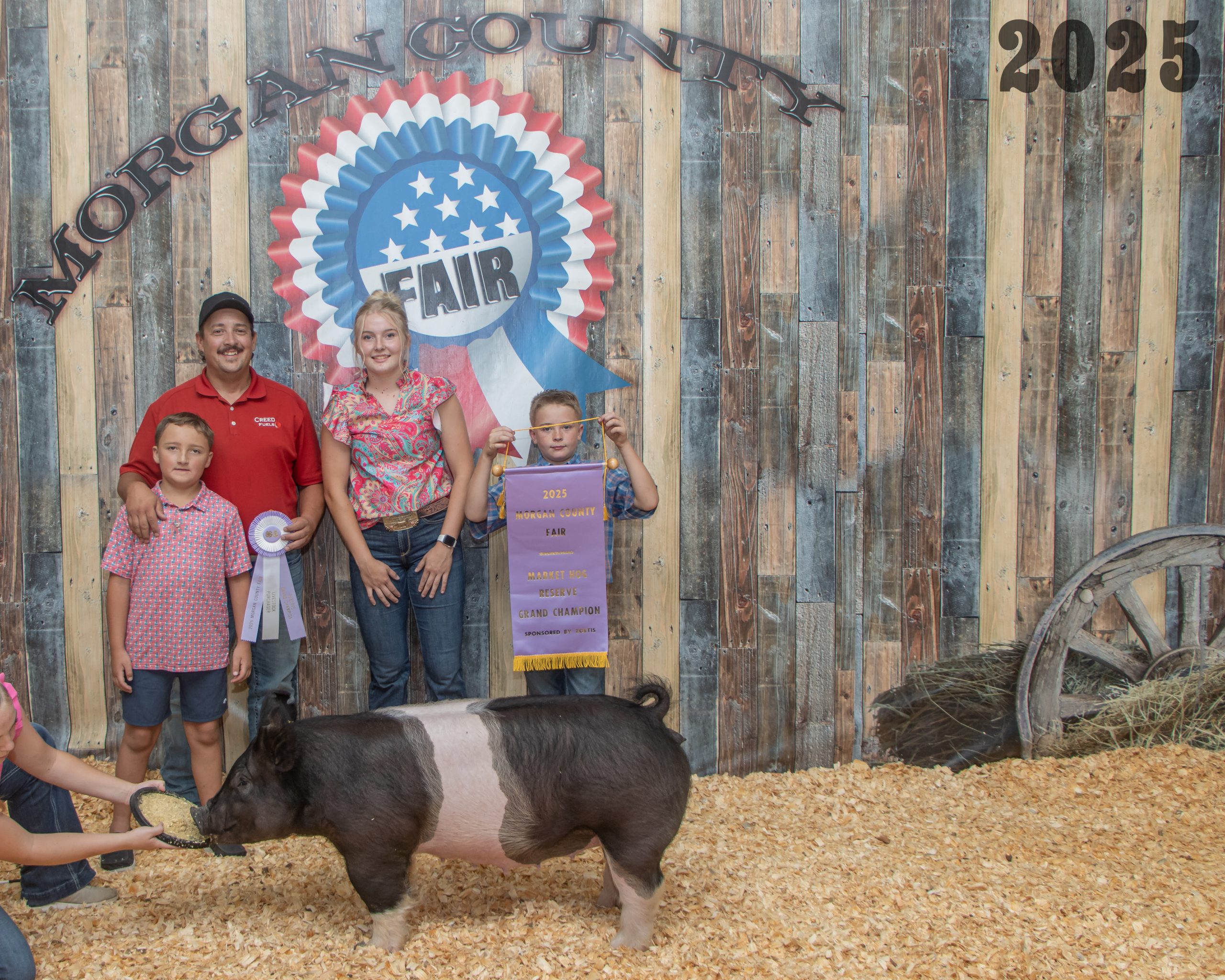 Reserve Grand Champion Market Swine - Riley Hunt with buyers